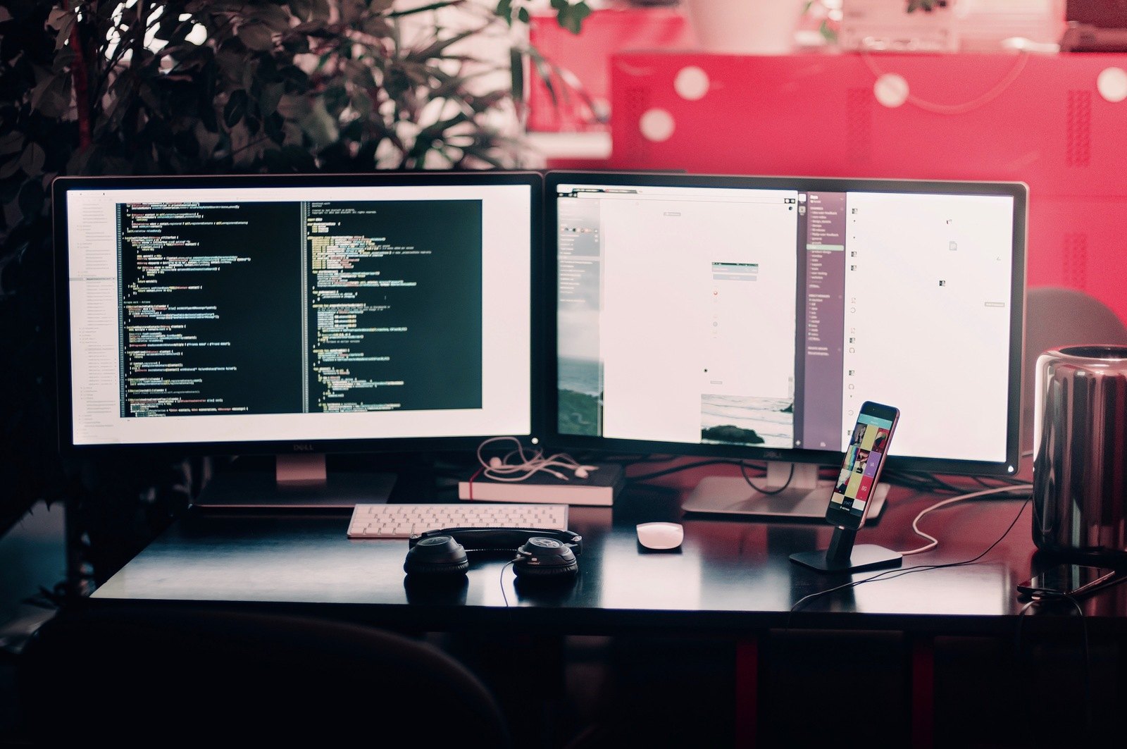 Two Black Computer Monitors on Black Table 3rd line support